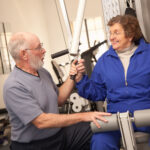 Active Senior Adult Couple Working Out Together in the Gym.