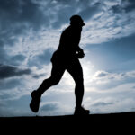 Silhouette Man running in the evening